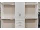 Well-organized walk-in closet with custom shelving and ample storage space for clothes and accessories at 5050 Surfside Cir, Lakewood Ranch, FL 34211