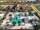 Aerial view of the community pool with cabanas, lounge chairs and lush landscaping at 5050 Surfside Cir, Lakewood Ranch, FL 34211