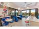 Retro-inspired dining area with a diner motif, including booths, barstools, and lake views at 5050 Surfside Cir, Lakewood Ranch, FL 34211