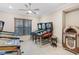 Bright game room featuring multiple pinball machines and a vintage jukebox for entertainment at 5050 Surfside Cir, Lakewood Ranch, FL 34211