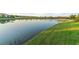 Scenic view of the serene lake, showcasing the peaceful surroundings and natural beauty at 5050 Surfside Cir, Lakewood Ranch, FL 34211