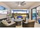Relaxing screened-in lanai offers outdoor seating with peaceful lake and pool views at 5050 Surfside Cir, Lakewood Ranch, FL 34211
