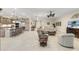 Open-concept living space with kitchen island, dining area, and comfortable seating at 5050 Surfside Cir, Lakewood Ranch, FL 34211