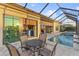 Outdoor entertaining area featuring a screened pool and a covered patio at 5050 Surfside Cir, Lakewood Ranch, FL 34211