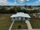 Aerial view of a single-story home with a large yard at 740 Floral Ln, Port Charlotte, FL 33952