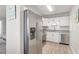 Modern kitchen with stainless steel appliances and white cabinets at 740 Floral Ln, Port Charlotte, FL 33952