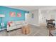 Open concept living and dining area with coastal decor at 740 Floral Ln, Port Charlotte, FL 33952