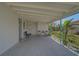 Covered side porch with seating and storage area at 740 Floral Ln, Port Charlotte, FL 33952