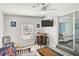 Sunroom with a small table and chairs, TV and access to the living room at 740 Floral Ln, Port Charlotte, FL 33952