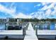 Dock with white posts shows water access for residents at the new listing at 8625 Midnight Pass Rd # 505B, Sarasota, FL 34242