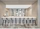 Modern bar area with counter seating, shelving, and elegant decor at 111 S Pineapple Ave # 1018, Sarasota, FL 34236
