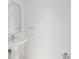 Bathroom featuring a pedestal sink with sleek fixtures and minimalist design at 111 S Pineapple Ave # 1018, Sarasota, FL 34236