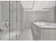 Modern bathroom features large glass walk-in shower and double vanity at 111 S Pineapple Ave # 1018, Sarasota, FL 34236