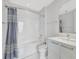 Modern bathroom featuring marble tile and a shower-tub combination at 111 S Pineapple Ave # 1018, Sarasota, FL 34236