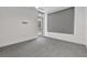 Bedroom featuring carpet, ceiling fan, and access to the balcony at 111 S Pineapple Ave # 1018, Sarasota, FL 34236