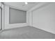 This bedroom features carpet and large window with a blind at 111 S Pineapple Ave # 1018, Sarasota, FL 34236
