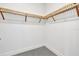 Bright closet is equipped with wooden storage shelving system at 111 S Pineapple Ave # 1018, Sarasota, FL 34236