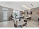 Inviting common area with tables, chairs, televisions, and a peaceful atmosphere at 111 S Pineapple Ave # 1018, Sarasota, FL 34236