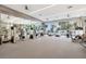 Modern gym with extensive fitness equipment, mirrored walls, and scenic views at 111 S Pineapple Ave # 1018, Sarasota, FL 34236