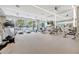 Bright and spacious gym with modern equipment, mirrored walls, and stunning city views at 111 S Pineapple Ave # 1018, Sarasota, FL 34236
