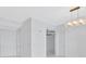 Living room featuring tile floors, access to other rooms, and a modern light fixture at 111 S Pineapple Ave # 1018, Sarasota, FL 34236