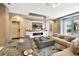 Inviting living room with modern fireplace, stylish furnishings, and a walkout to the outdoor patio at 111 S Pineapple Ave # 1018, Sarasota, FL 34236