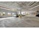 Clean and spacious parking garage with ample parking spots and natural light from several windows at 111 S Pineapple Ave # 1018, Sarasota, FL 34236