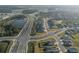 Aerial view of neighborhood with lake and homes at 11160 Fieldstone Dr, Palmetto, FL 34221