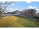 Spacious backyard with screened patio and grassy area at 11160 Fieldstone Dr, Palmetto, FL 34221