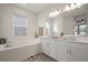 Elegant bathroom with double vanity, soaking tub, and separate shower at 11160 Fieldstone Dr, Palmetto, FL 34221