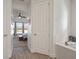 View into bedroom from hallway, showing bedroom with window and ceiling fan at 11160 Fieldstone Dr, Palmetto, FL 34221