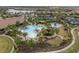 Community pool with lounge chairs and landscaping at 11160 Fieldstone Dr, Palmetto, FL 34221