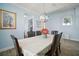 Elegant dining room featuring a spacious table and modern chandelier at 11160 Fieldstone Dr, Palmetto, FL 34221