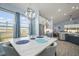 Modern dining area with a marble table and large windows at 11160 Fieldstone Dr, Palmetto, FL 34221