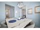 Bright dining room with a marble table and chandelier at 11160 Fieldstone Dr, Palmetto, FL 34221