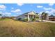 Landscaped front yard with curb appeal and mature plants at 11160 Fieldstone Dr, Palmetto, FL 34221