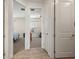 Hallway with doors leading to bedrooms at 11160 Fieldstone Dr, Palmetto, FL 34221
