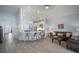Open kitchen with island, stainless steel appliances, and light blue cabinets at 11160 Fieldstone Dr, Palmetto, FL 34221