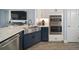 Kitchen features a farmhouse sink and double oven at 11160 Fieldstone Dr, Palmetto, FL 34221