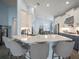 Open kitchen with island, stainless steel appliances, and light blue cabinets at 11160 Fieldstone Dr, Palmetto, FL 34221