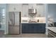 Modern kitchen with stainless steel appliances and white cabinetry at 11160 Fieldstone Dr, Palmetto, FL 34221