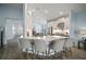Open kitchen with island, stainless steel appliances, and light blue cabinets at 11160 Fieldstone Dr, Palmetto, FL 34221