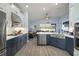 Modern kitchen with stainless steel appliances and blue cabinetry at 11160 Fieldstone Dr, Palmetto, FL 34221