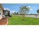 Landscaped backyard with a view of the lake at 13789 Old Creek Ct, Parrish, FL 34219