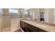 Double vanity bathroom with granite countertop and walk-in shower at 13789 Old Creek Ct, Parrish, FL 34219