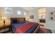 Guest bedroom with a queen-size bed, window, and access to a shared bath at 13789 Old Creek Ct, Parrish, FL 34219
