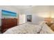 Bright bedroom with a comfortable bed, large TV, and spacious dresser at 13789 Old Creek Ct, Parrish, FL 34219