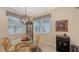 Cozy breakfast nook with glass-top table and wicker chairs at 13789 Old Creek Ct, Parrish, FL 34219