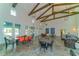 Community room featuring high ceilings, exposed beams, and comfortable seating at 13789 Old Creek Ct, Parrish, FL 34219