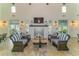 Relaxing community room with fireplace, comfortable seating, and a large TV at 13789 Old Creek Ct, Parrish, FL 34219